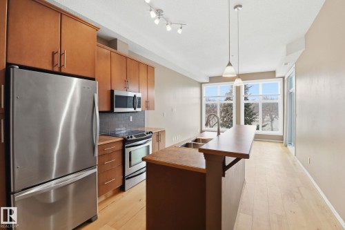 330 10531 117 Street, Edmonton, AB - Indoor Photo Showing Kitchen With Stainless Steel Kitchen With Double Sink