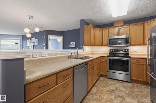 406 7839 96 Street, Edmonton, AB - Indoor Photo Showing Kitchen With Double Sink