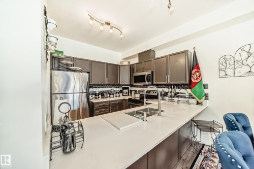 207 4316 139 Avenue, Edmonton, AB - Indoor Photo Showing Kitchen With Double Sink