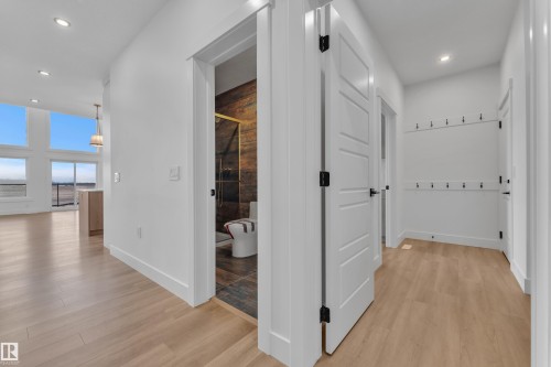 Bright hallway featuring light wood-finish flooring and recessed lighting - 13128 187 Avenue, Edmonton, AB - Indoor Photo Showing Other Room