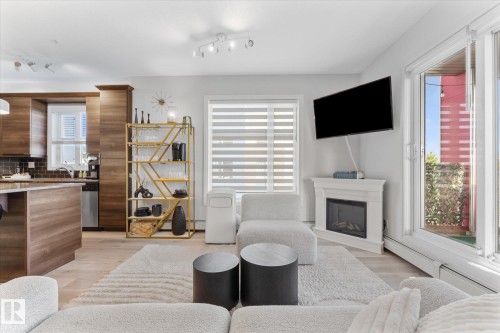 313 2590 Anderson Way, Edmonton, AB - Indoor Photo Showing Living Room With Fireplace