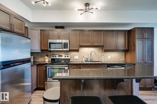 407 10303 111 Street, Edmonton, AB - Indoor Photo Showing Kitchen With Stainless Steel Kitchen With Upgraded Kitchen