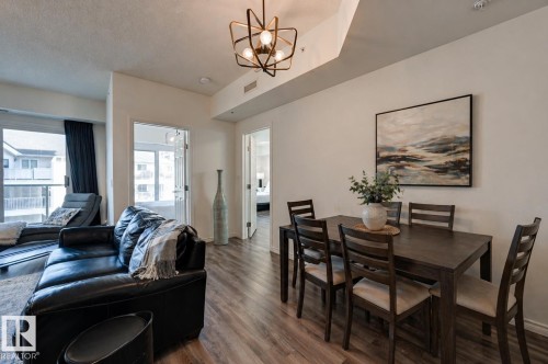 Image digitally altered to show dining space - 407 10303 111 Street, Edmonton, AB - Indoor Photo Showing Dining Room