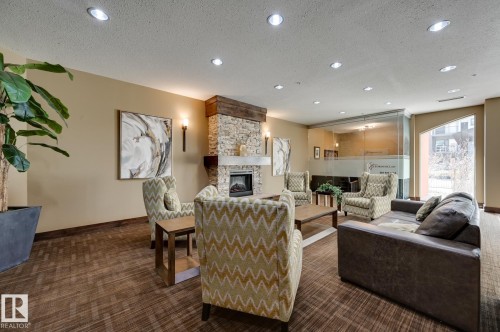407 10303 111 Street, Edmonton, AB - Indoor Photo Showing Living Room With Fireplace