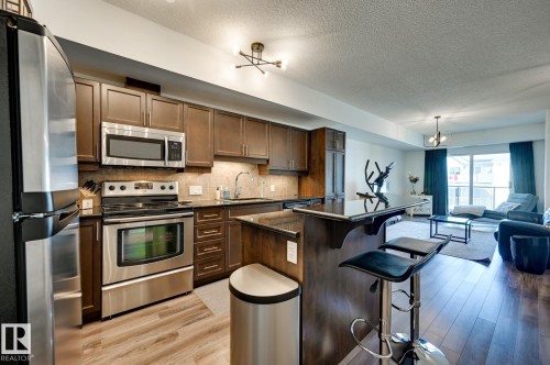 407 10303 111 Street, Edmonton, AB - Indoor Photo Showing Kitchen With Stainless Steel Kitchen With Upgraded Kitchen