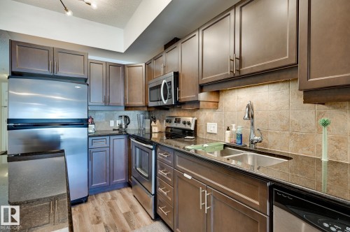 407 10303 111 Street, Edmonton, AB - Indoor Photo Showing Kitchen With Stainless Steel Kitchen With Double Sink With Upgraded Kitchen