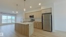 Main 1037 Aster Boulevard, Edmonton, AB  - Indoor Photo Showing Kitchen With Stainless Steel Kitchen With Double Sink With Upgraded Kitchen 