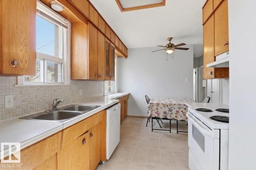 9206 / 9208 90 Street, Edmonton, AB - Indoor Photo Showing Kitchen With Double Sink