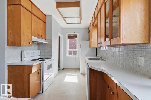 9206 / 9208 90 Street, Edmonton, AB - Indoor Photo Showing Kitchen With Double Sink