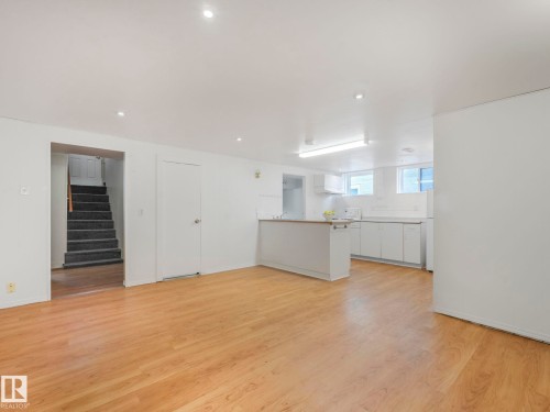 Open concept living space with light wood flooring and recessed lighting - 10645 62 Avenue, Edmonton, AB - Indoor Photo Showing Other Room