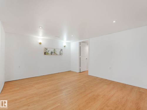 Spacious room featuring light-colored flooring, white walls, and recessed lighting - 10645 62 Avenue, Edmonton, AB - Indoor Photo Showing Other Room