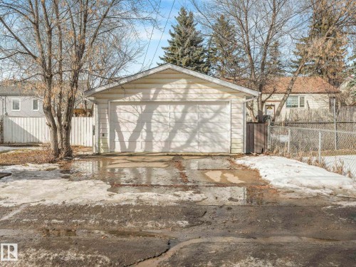 The property includes a detached single-door garage with white siding - 10645 62 Avenue, Edmonton, AB - Outdoor