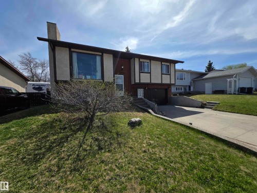 Split-level residence featuring a single-car garage and a concrete driveway - 4029 55 Avenue, Drayton Valley, AB - Outdoor