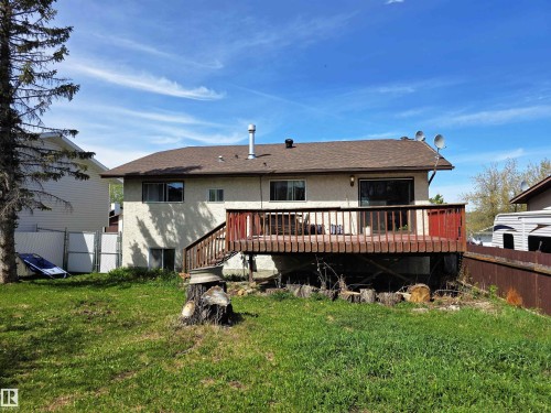 Raised wood deck with dark stained railing - 4029 55 Avenue, Drayton Valley, AB - Outdoor With Deck Patio Veranda