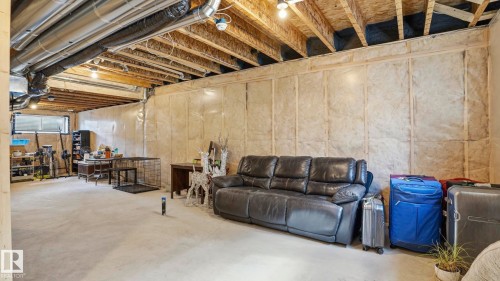 Unfinished basement offering expansive concrete flooring and exposed ceiling joists - 17364 2 Street, Edmonton, AB - Indoor Photo Showing Basement