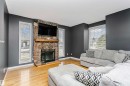 4708 45 Street, Gibbons, AB  - Indoor Photo Showing Living Room With Fireplace 