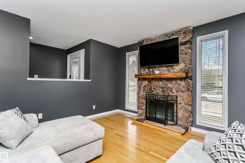 4708 45 Street, Gibbons, AB - Indoor Photo Showing Living Room With Fireplace