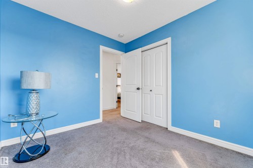 Room featuring light blue walls and gray carpet flooring - 2292 Casey Crescent, Edmonton, AB - Indoor