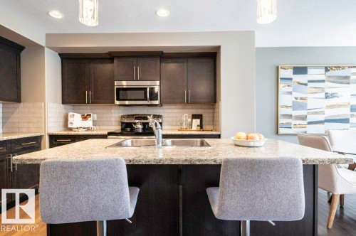 471 Reed Crescent, Leduc, AB - Indoor Photo Showing Kitchen With Stainless Steel Kitchen With Double Sink With Upgraded Kitchen