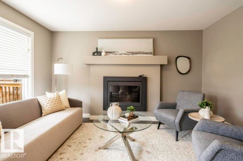 471 Reed Crescent, Leduc, AB - Indoor Photo Showing Living Room With Fireplace