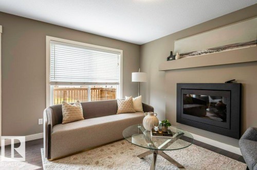 471 Reed Crescent, Leduc, AB - Indoor Photo Showing Living Room With Fireplace