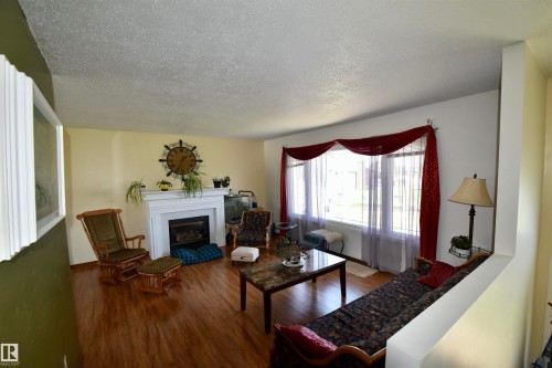 4126A 47 Avenue, St. Paul Town, AB - Indoor Photo Showing Living Room With Fireplace