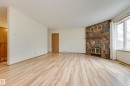 17310 Callingwood Road, Edmonton, AB  - Indoor Photo Showing Living Room With Fireplace 