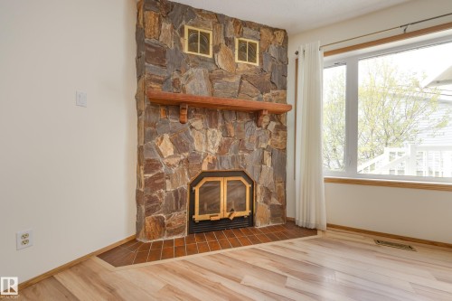 17310 Callingwood Road, Edmonton, AB - Indoor Photo Showing Other Room With Fireplace