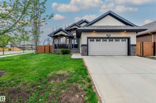 Contemporary single-story residence featuring light-toned siding and dark trim - 19 Newton Place, St. Albert, AB - Outdoor