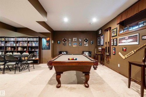 Recreation room featuring recessed lighting, a built-in shelving unit, and carpet flooring - 19 Newton Place, St. Albert, AB - Indoor Photo Showing Other Room
