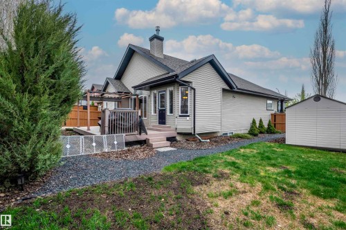 Rear exterior featuring a multi-level deck, pergola, and direct access to the interior - 19 Newton Place, St. Albert, AB - Outdoor