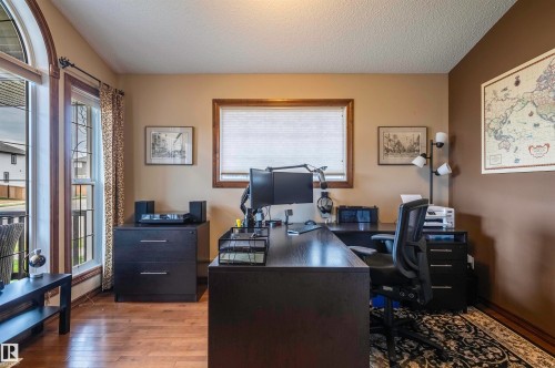 Wood-finish flooring throughout - 19 Newton Place, St. Albert, AB - Indoor Photo Showing Office