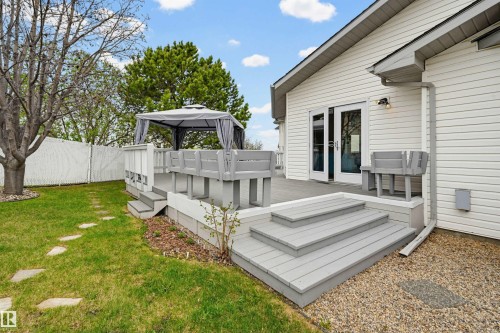 Multi-level composite deck with built-in bench seating and a shaded gazebo area - 317 Hollick-Kenyon Road, Edmonton, AB - Outdoor With Deck Patio Veranda