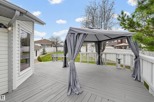 Expansive exterior deck featuring a grey finish, white railings, a bay window, and a grey gazebo - 317 Hollick-Kenyon Road, Edmonton, AB - Outdoor With Deck Patio Veranda