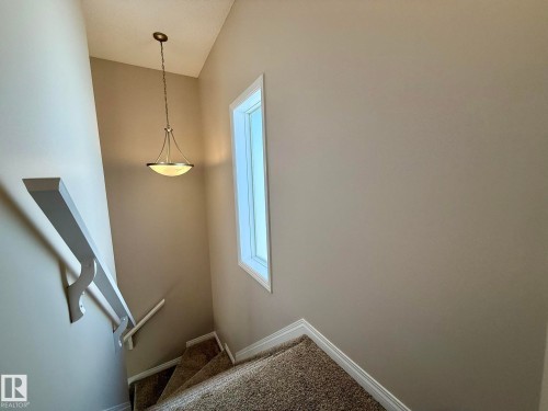 ANOTHER PHOTO OF THE STAIRS LOOKING DOWN WITH THE NEW PLUSH CARPET & 8lb UNDERLAY WAITING TO SERVE YOU FOR YEARS TO COME! :) - 645 Windross Crescent, Edmonton, AB 