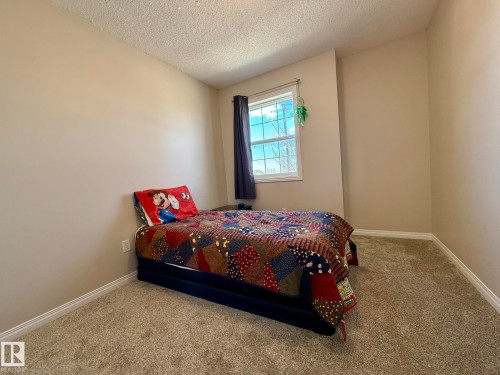 PHOTO OF THE 3rd UPPER FLOOR BEDROOM WITH ALL NEW PAINT & THE PLUSH CARPET TOO! - 645 Windross Crescent, Edmonton, AB 