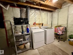 PHOTO OF THE BASEMENT LAUNDRY ROOM AREA! - 