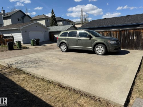 Concrete parking pad providing off-street parking & Ready for YOU to build a GARAGE! - 645 Windross Crescent, Edmonton, AB 