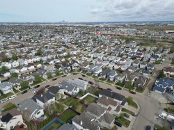 Extensive residential area featuring numerous single-family homes with varying architectural styles - 