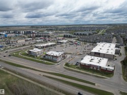 Commercial retail development featuring multiple tenant spaces and ample on-site parking - 