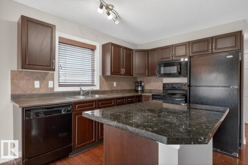 55 Keystone Crescent, Leduc, AB - Indoor Photo Showing Kitchen With Double Sink
