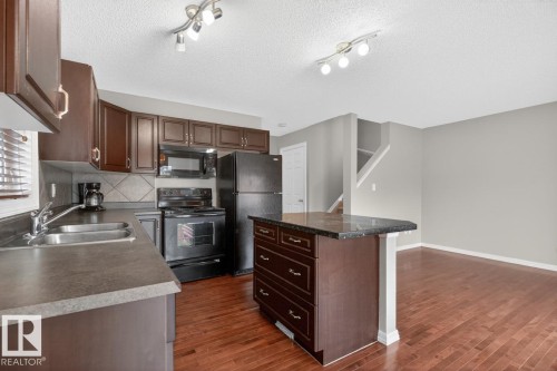 55 Keystone Crescent, Leduc, AB - Indoor Photo Showing Kitchen With Double Sink