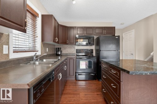 55 Keystone Crescent, Leduc, AB - Indoor Photo Showing Kitchen With Double Sink