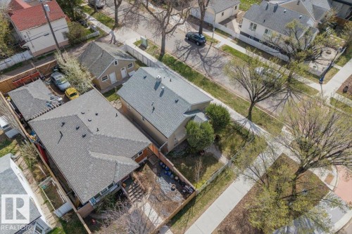 Aerial perspective showcasing a property with a gray shingle roof, accompanied by a detached garage with a tan exterior - 10939 96 Street, Edmonton, AB - Outdoor