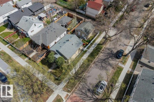 Residential property featuring a rectangular lot, mature trees, and street parking - 10939 96 Street, Edmonton, AB - Outdoor With View