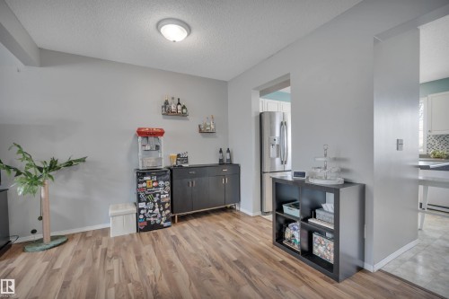 Neutral wall color with wood-finish flooring - 102 4415 South Park Drive, Leduc, AB - Indoor