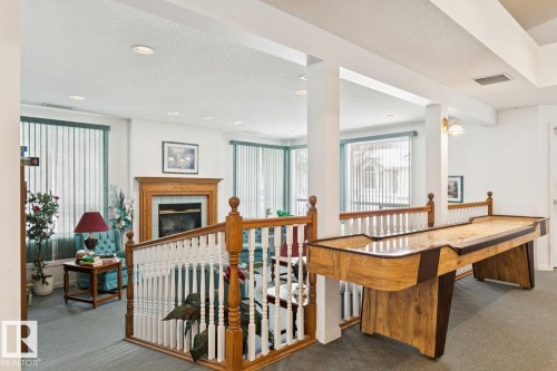 303 Twin Brooks Drive, Edmonton, AB - Indoor Photo Showing Other Room With Fireplace
