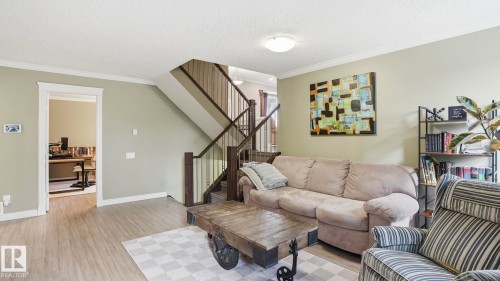 Hardwood-look flooring throughout the main level - 27 Addison Crescent, St. Albert, AB - Indoor Photo Showing Living Room