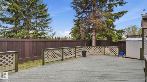 Spacious outdoor deck featuring gray-painted wood planks and lattice railings - 27 Addison Crescent, St. Albert, AB - Outdoor With Deck Patio Veranda