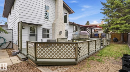 Expansive wooden deck with lattice railing, featuring multiple levels and direct access to the interior - 27 Addison Crescent, St. Albert, AB - Outdoor With Exterior